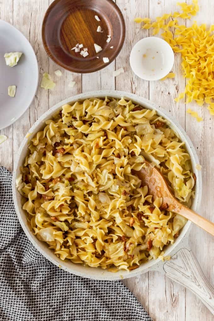 Pan full of Haluski, fried cabbage and noodles.