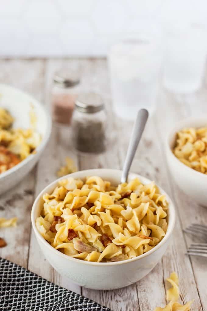 Bowl full of Haluski with a fork in it. 