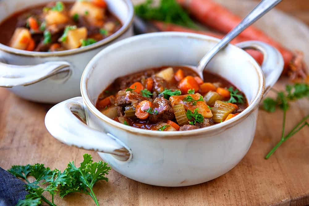 A bowl of instant pot beef stew with parsley 