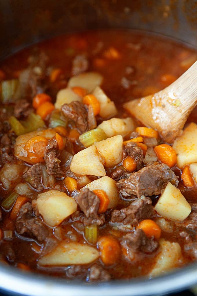 Stirring a pot on beef stew.