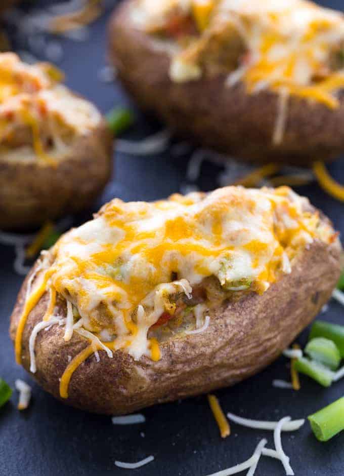 Twice baked pepper stuffed potatoes  covered with melted cheese