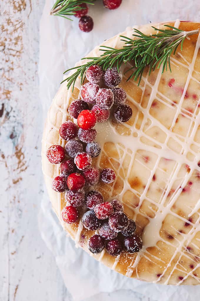 Cranberry White Chocolate Cheesecake overhead shot, showing half the cheesecake. 