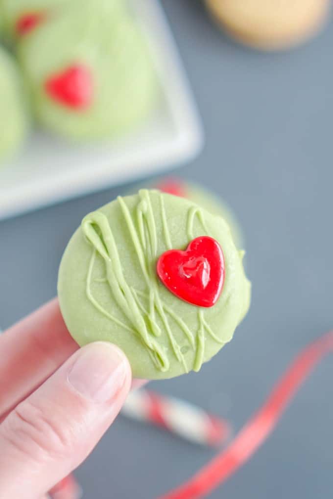 Holding a Grinch Cookie