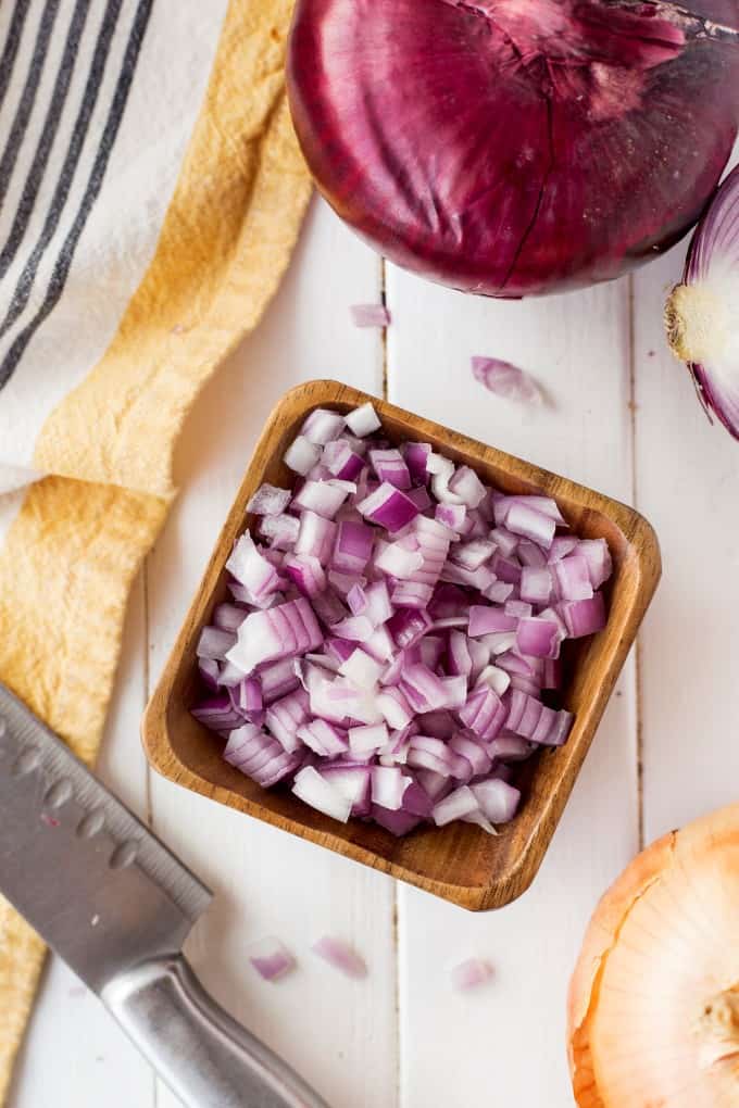 Overhead of diced red onion in a bowl