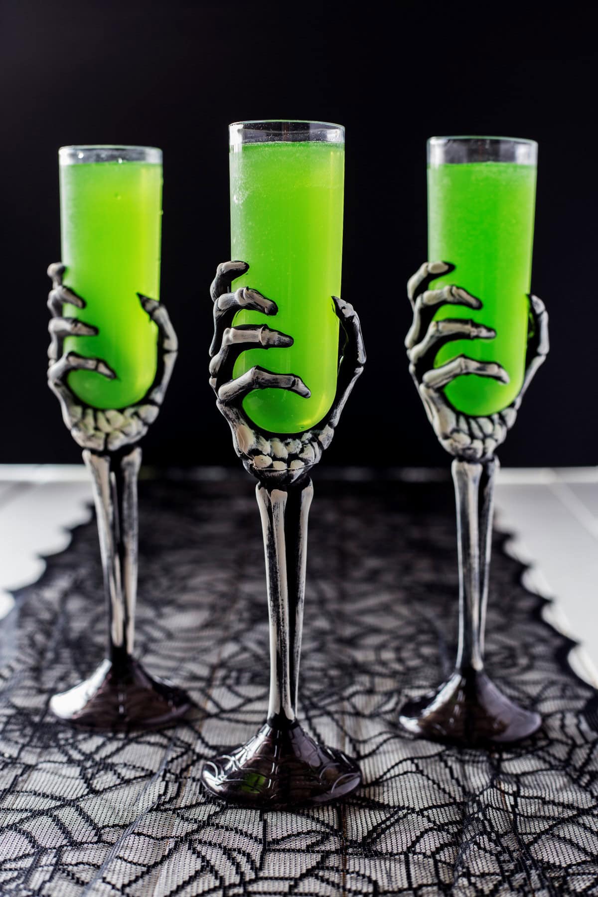 Three Embalming Fluid Cocktails in skeleton glasses.. 