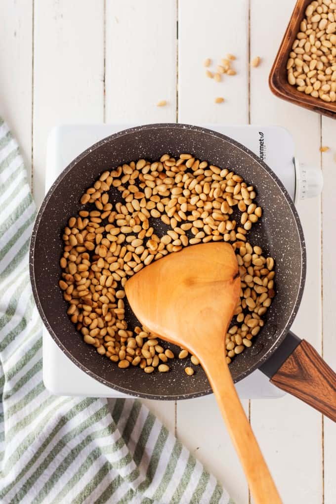 Toasting pine nuts in a skillet