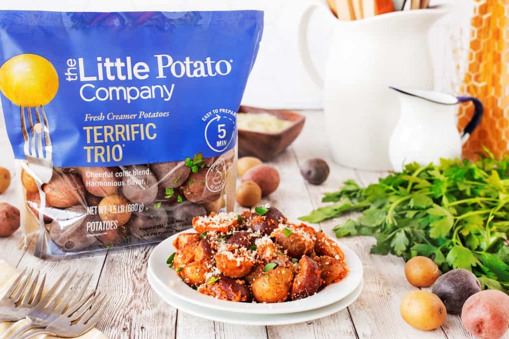The Little Potato Company's Terrific Trio potatoes with a plate of red pesto potatoes. 