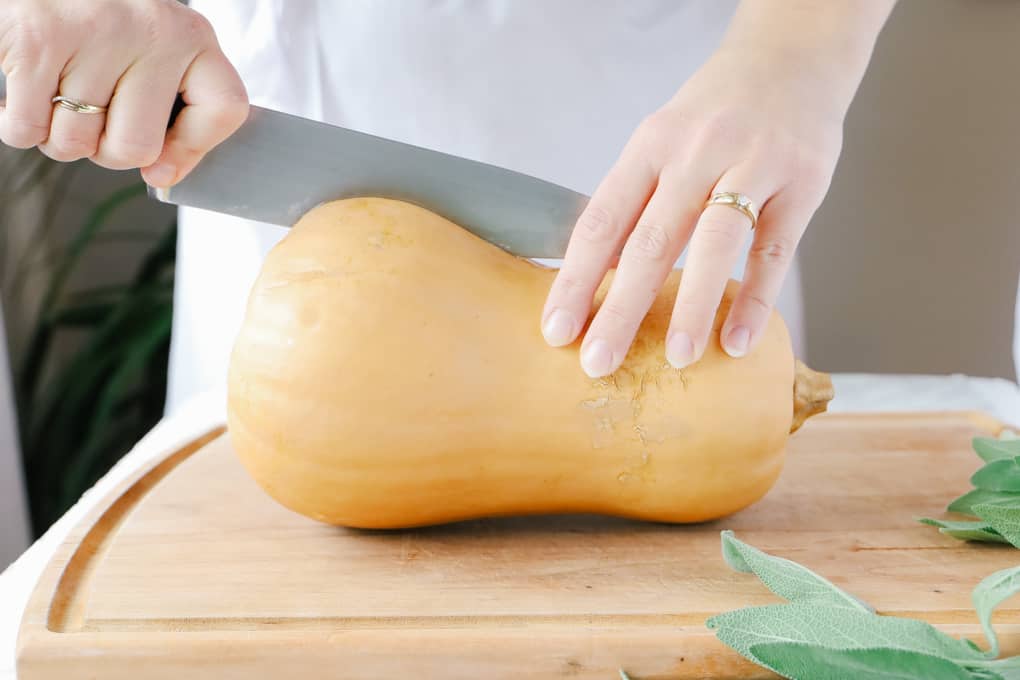 Cutting a butternut squash in halve