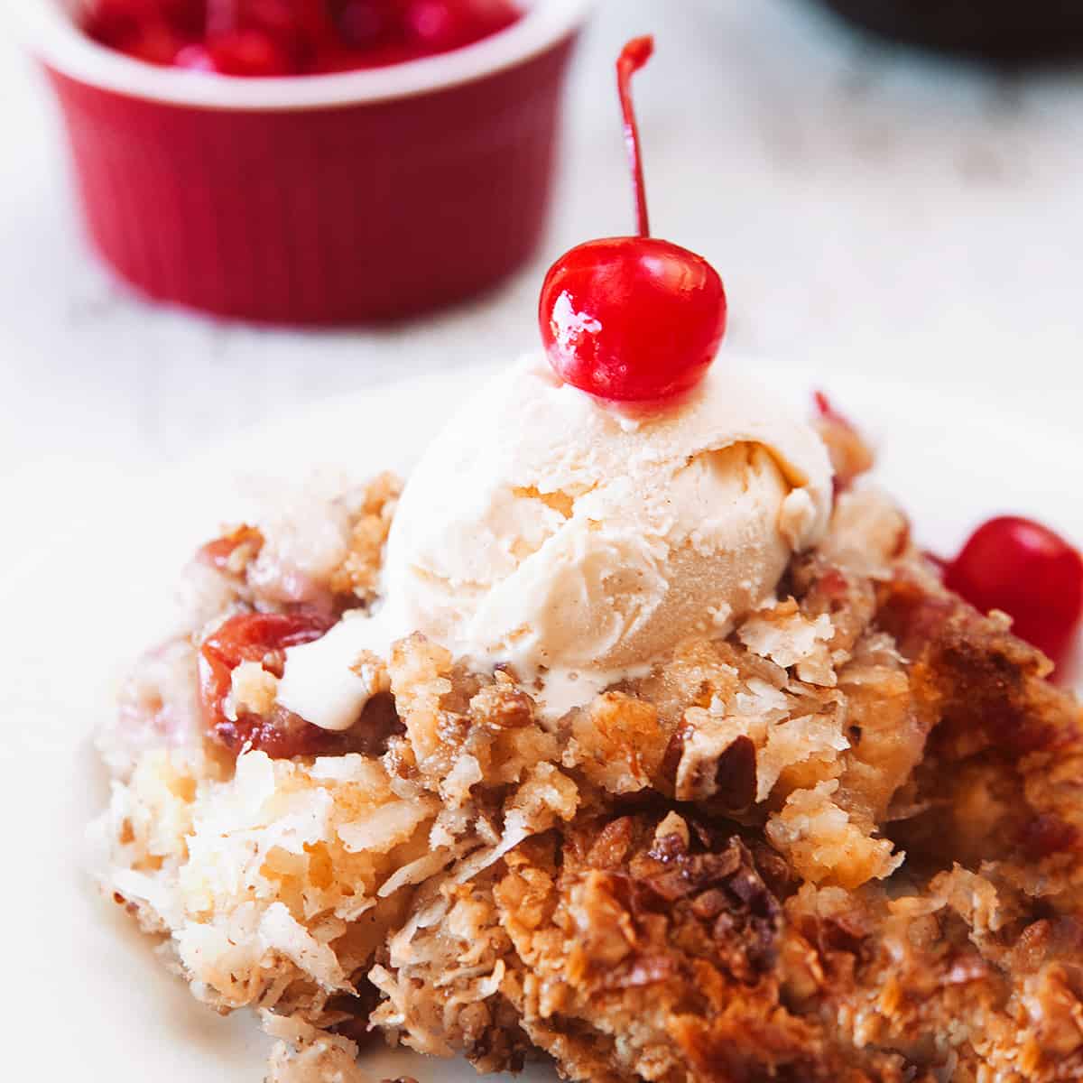 Dump cake with ice cream and a cherry on top!