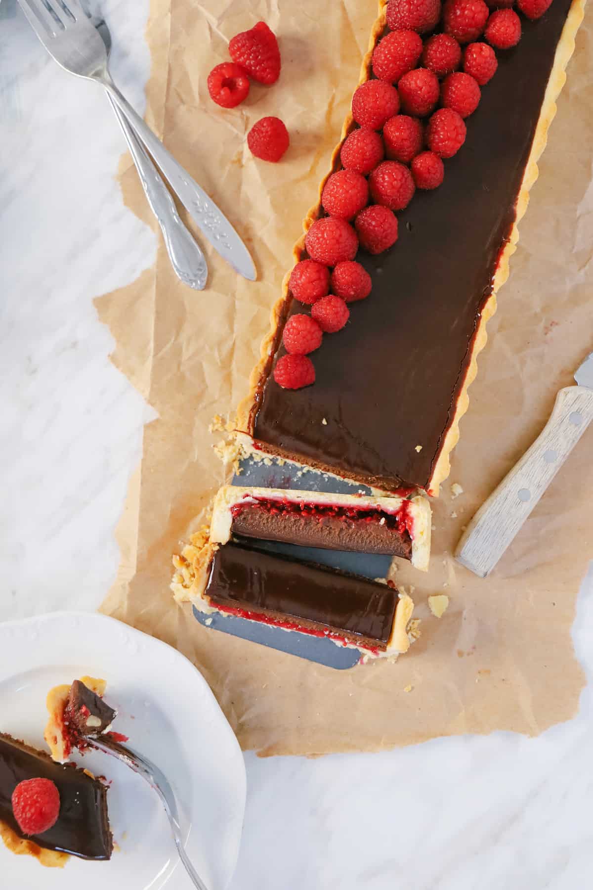 Overhead shot of a chocolate tart being sliced