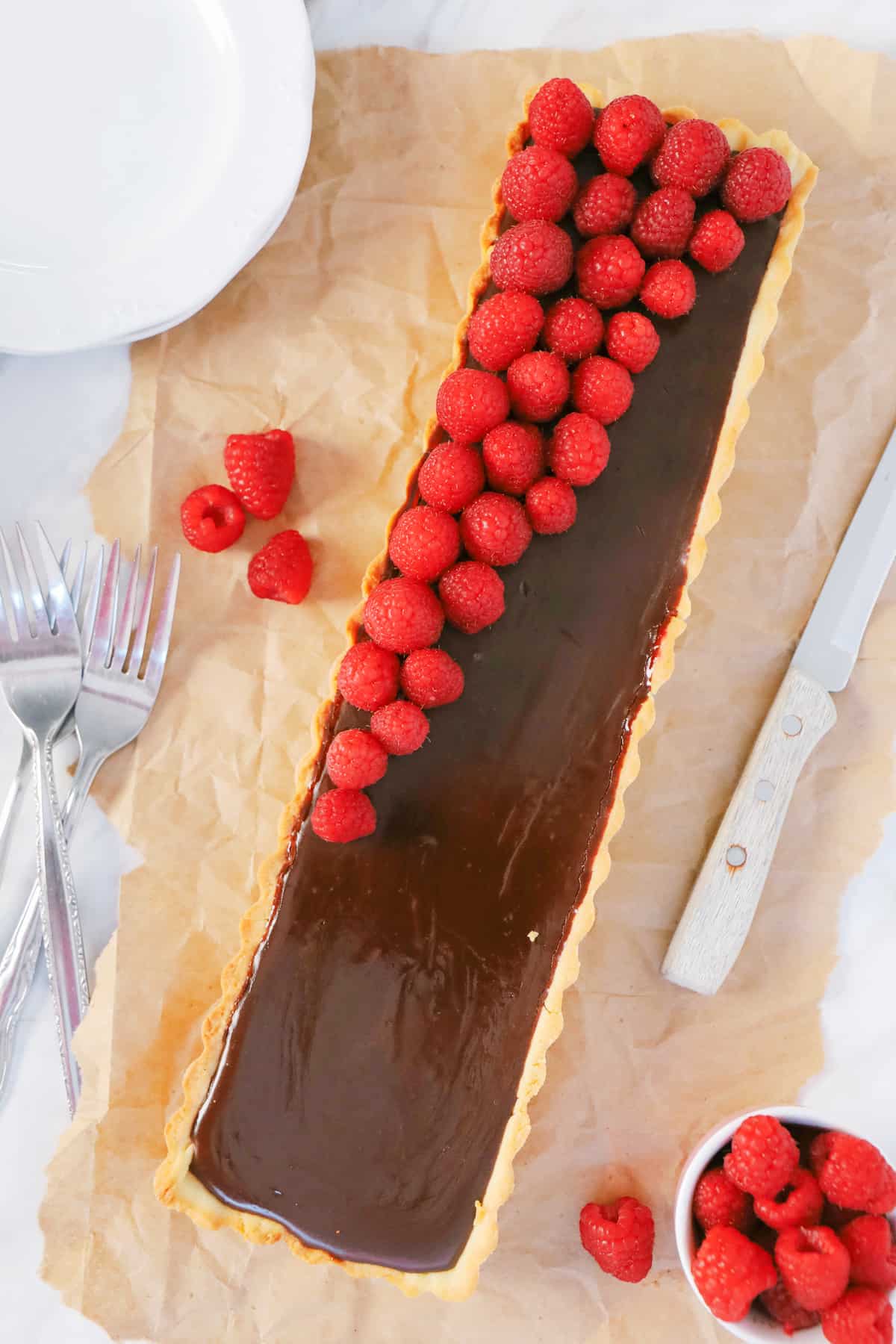 Overhead shot of a chocolate tart with raspberry jam