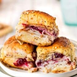 3 Havarti Cranberry Turkey sliders stack on a white plate