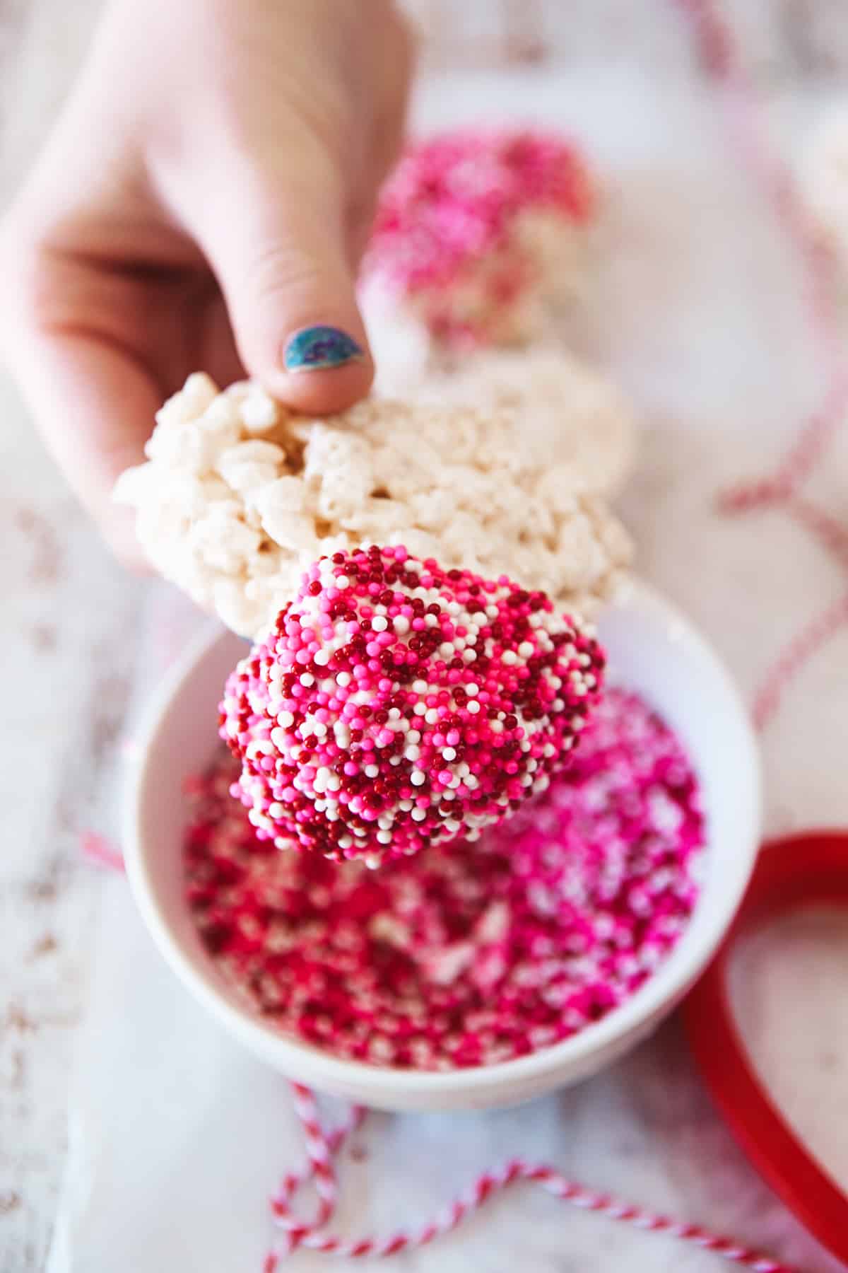 Showing lots of sprinkles on a heart shaped rice Krispie. 