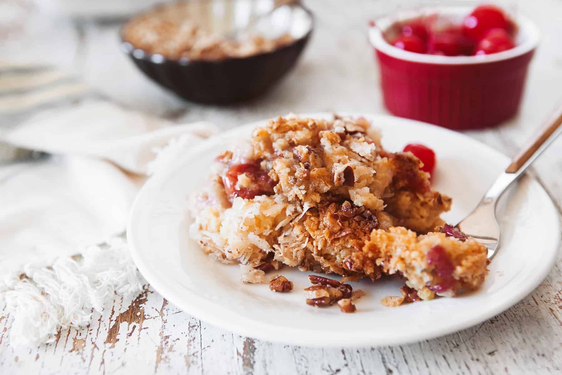 Cherry Pineapple Dump Cake on a dessert plate.