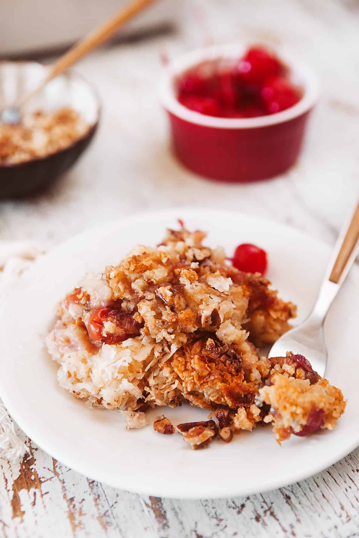 Cherry Pineapple Dump Cake on a dessert plate.