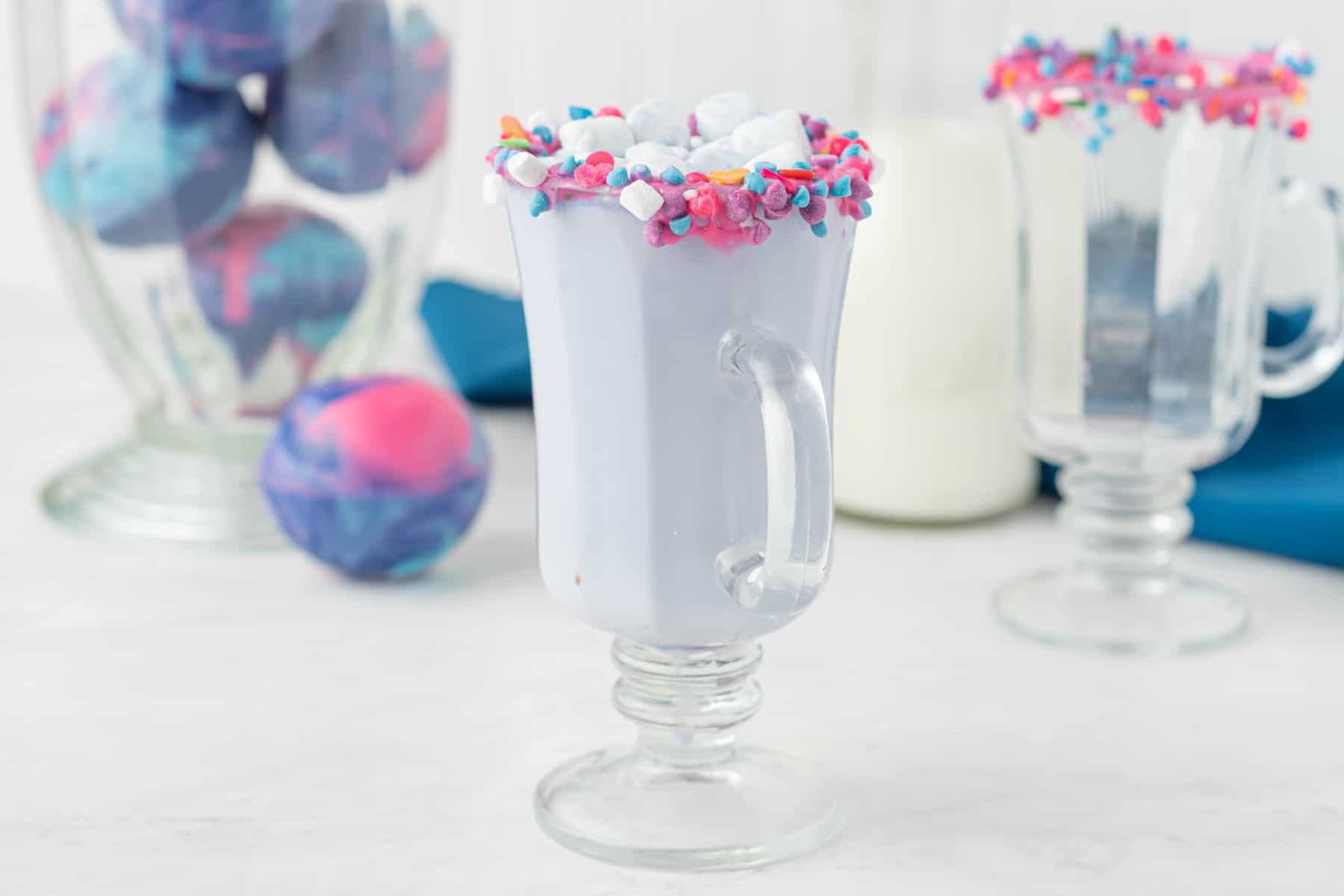 A glass of hot cocoa made from a Galaxy Hot Chocolate Bomb. 