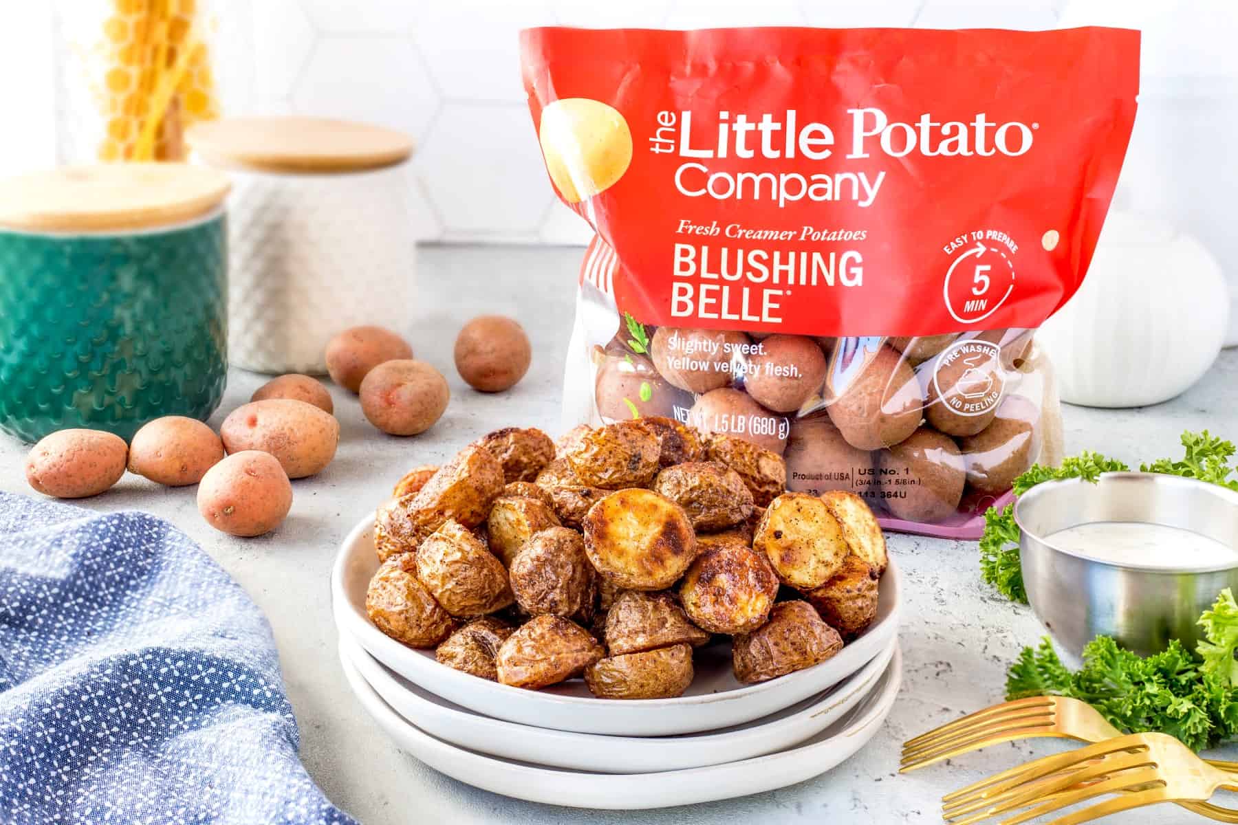 Plateful of potatoes with a bag of Little Potatoes Company in the background