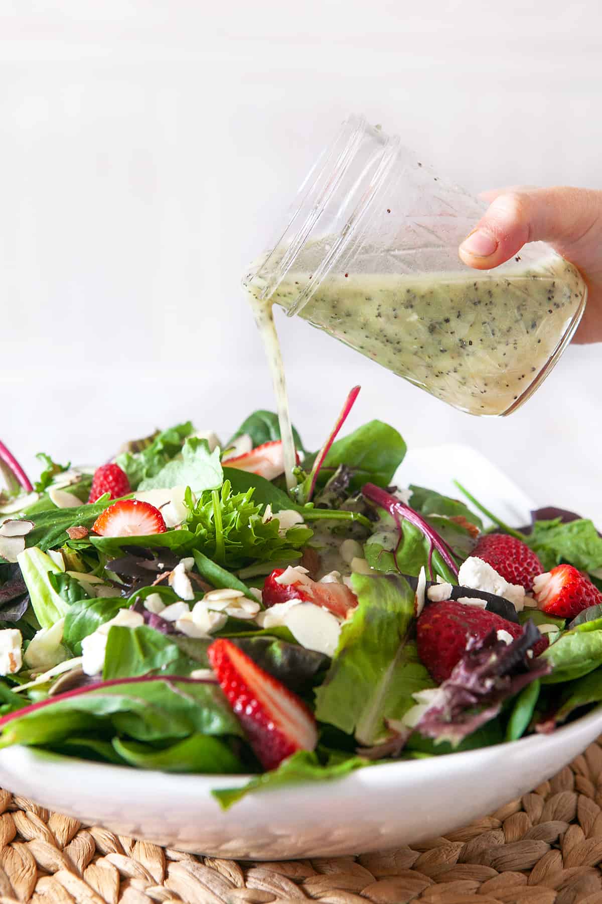 Poppy Seed Dressing on a spinach strawberry salad