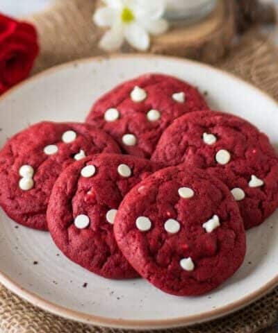 Red Velvet Cookies stacked on a white plate
