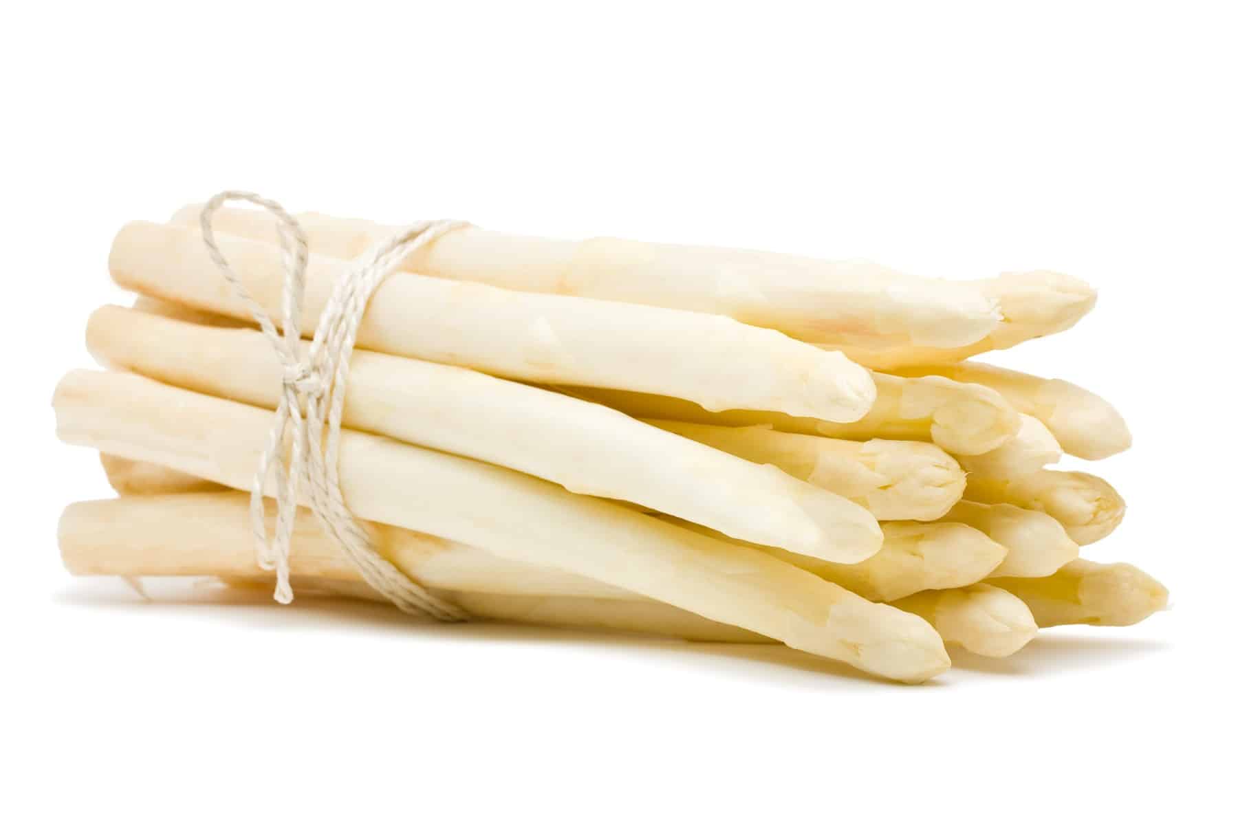 Fresh cut white asparagus over white background