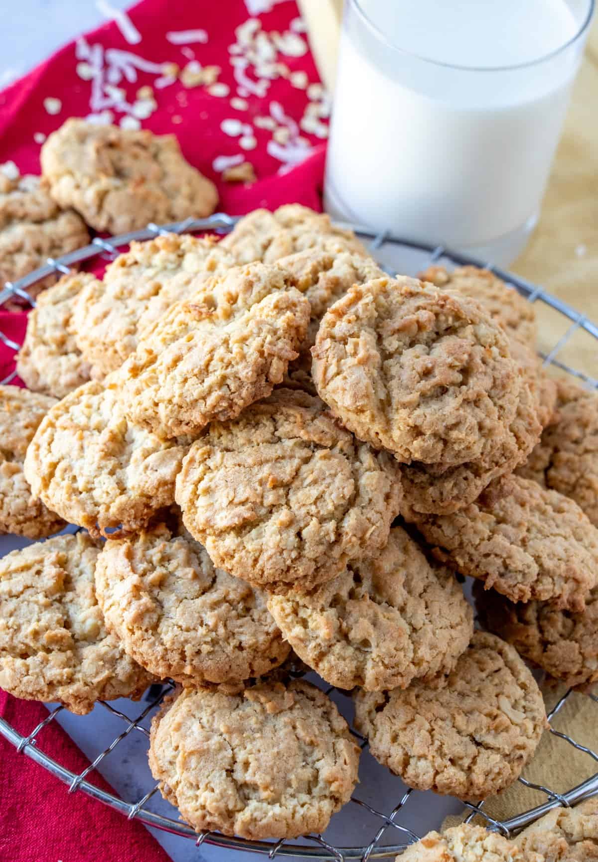 A pile of cookies on a cooling rack. 