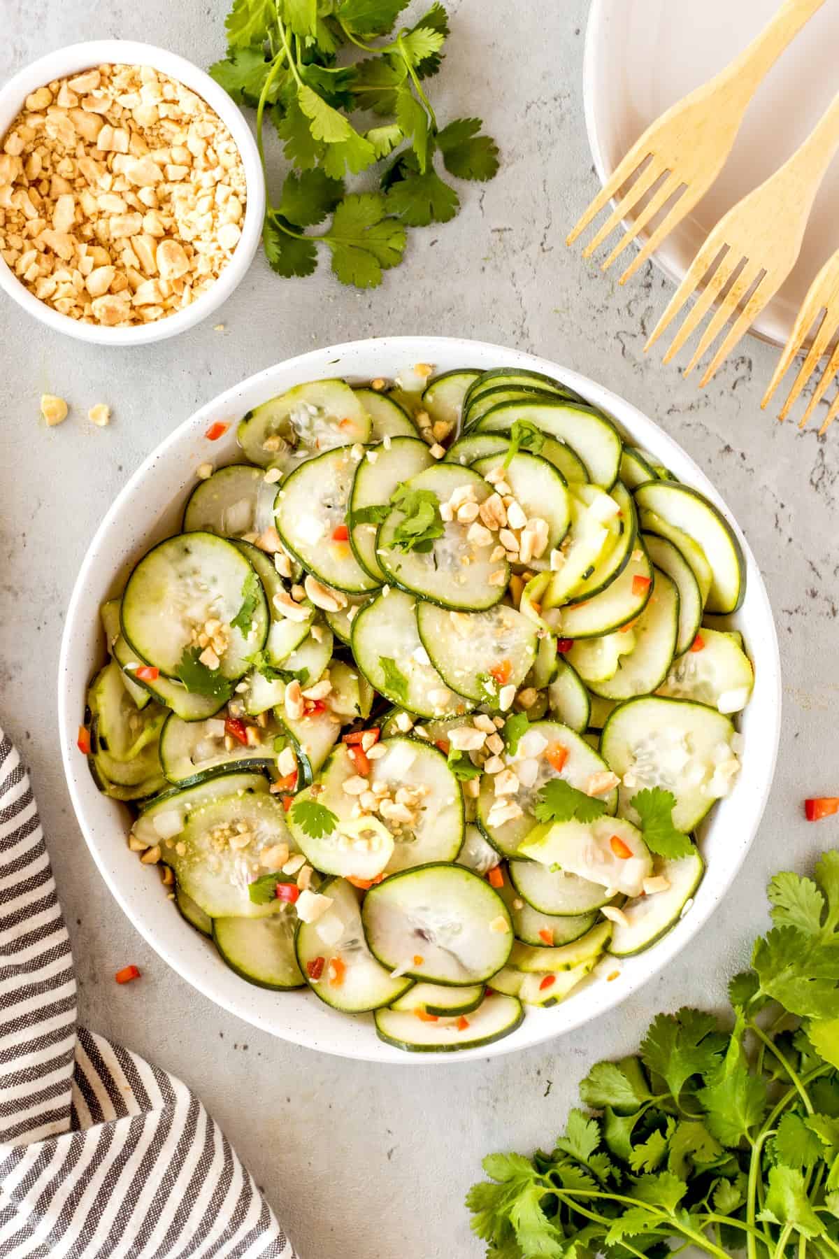Overhead of Easy Asian Inspired Cucumber Salad in a white bowl