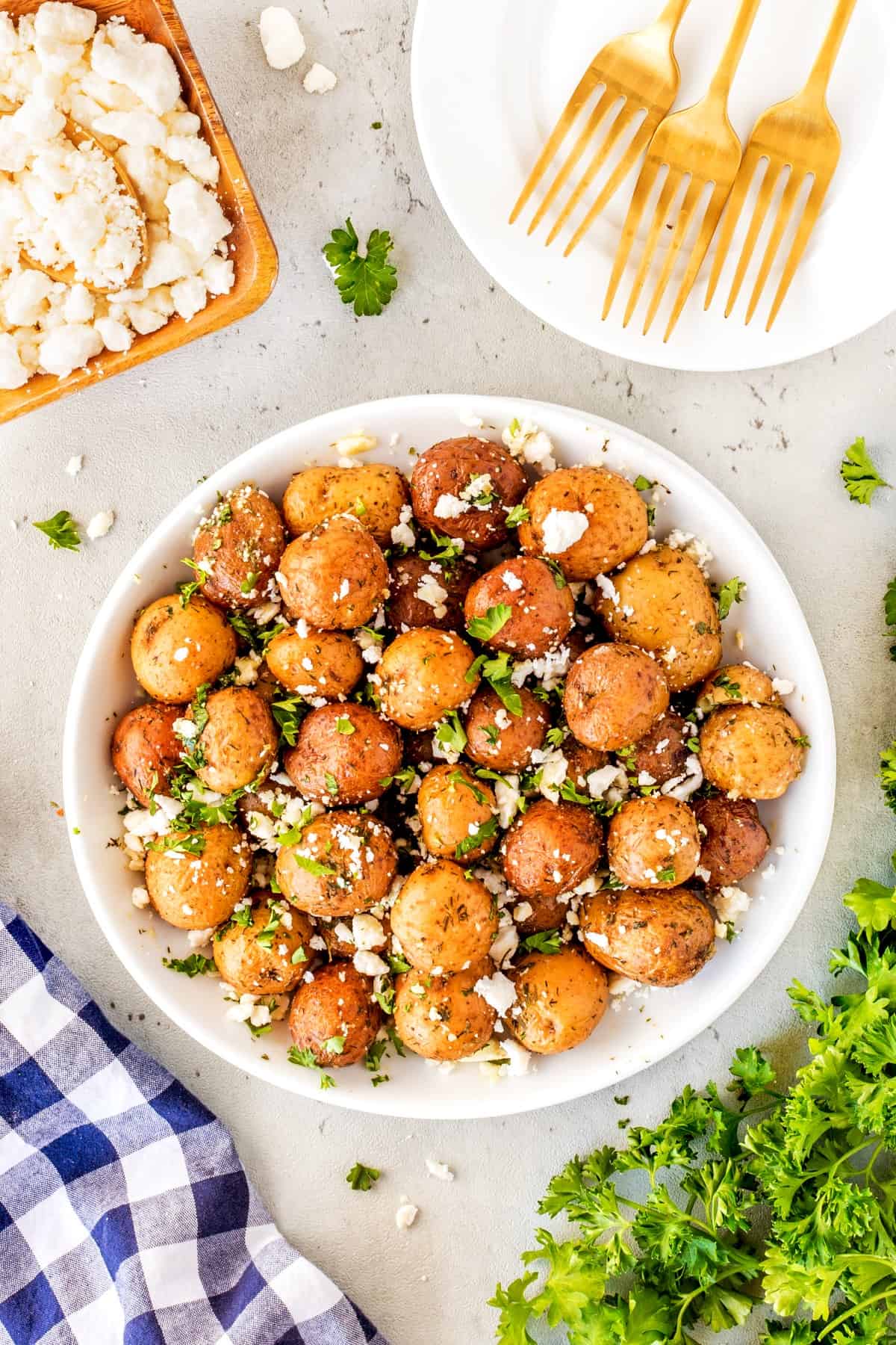Overhead shot of Greek potatoes in a bowl. 