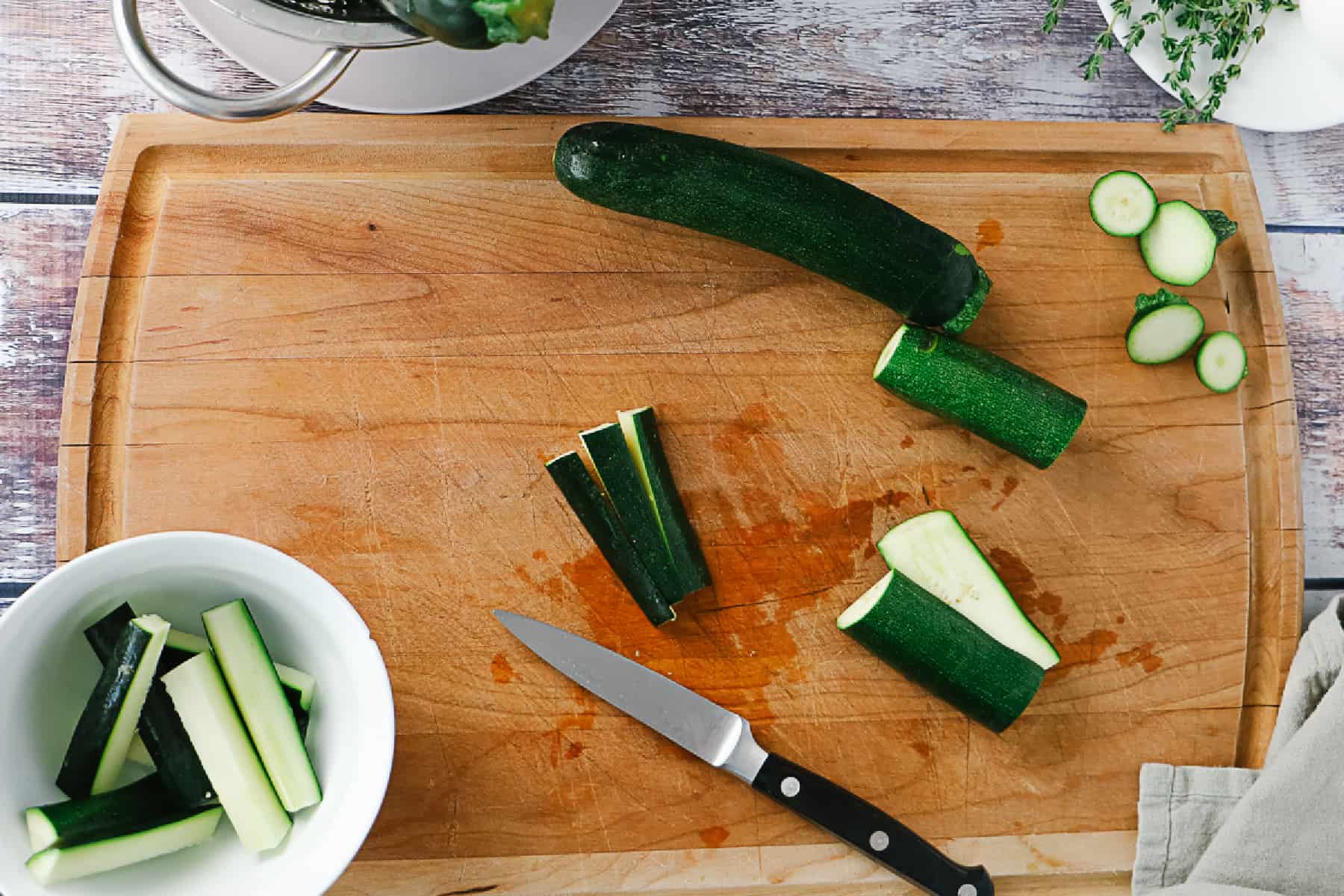 Cutting zucchini on a board