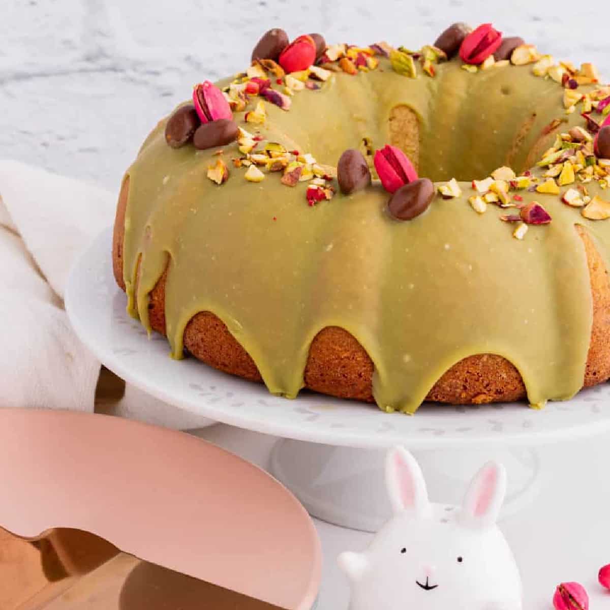 Pistachio Bundt Cake on a cake stand