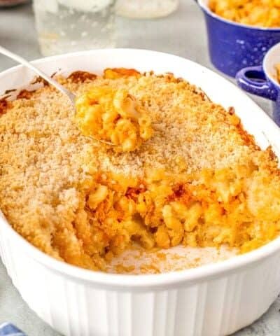 Buffalo Chicken Mac and Cheese in a casserole being scooped out