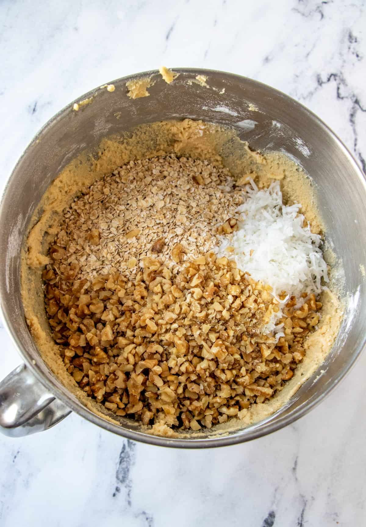 Overhead shot of ingredients in a bowl for oatmeal cookies