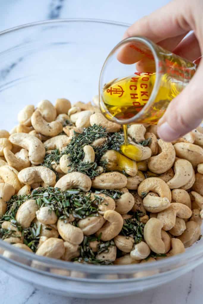 Pouring oil on cashews