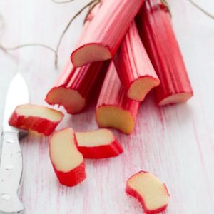 A bunch of rhubarb tied and the first ends sliced