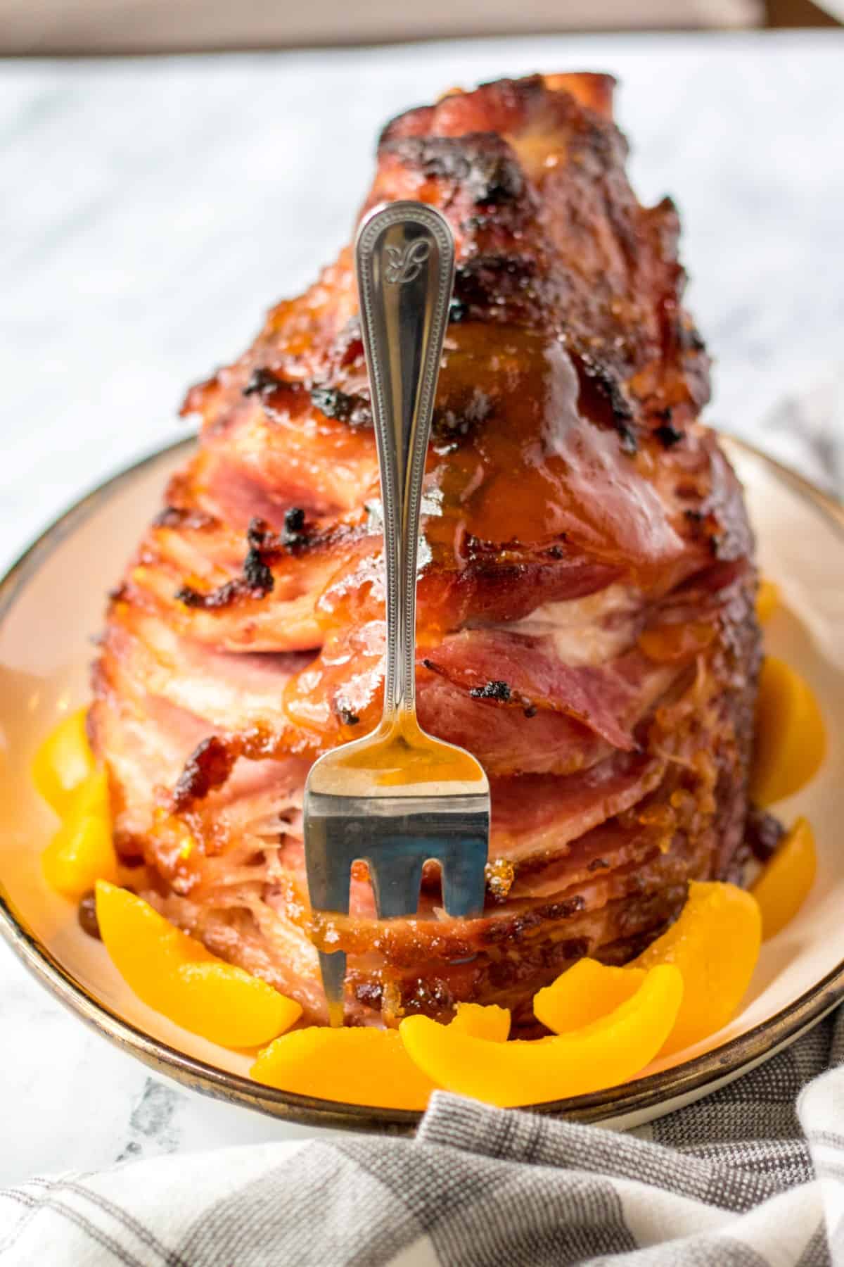 A fork standing up in front of a ham