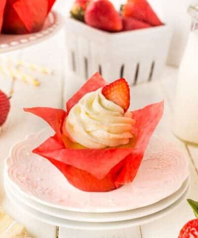 Strawberry Cupcake on a white stack of plates