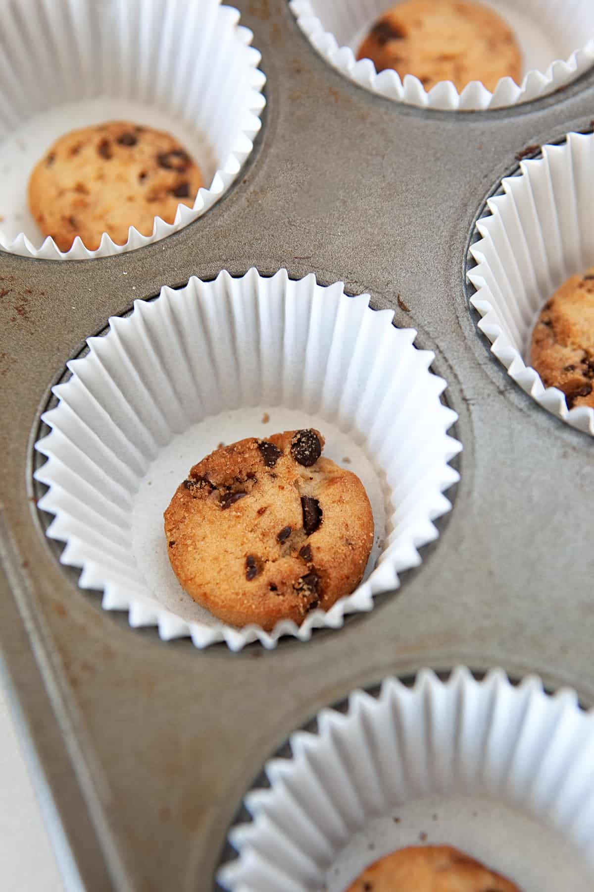 A cookie in the bottom of a cupcake liner. 