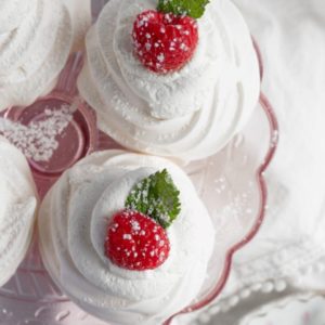 Overhead shot of pavlovas on a pink stand