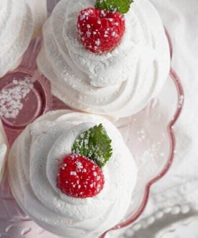 Overhead shot of pavlovas on a pink stand