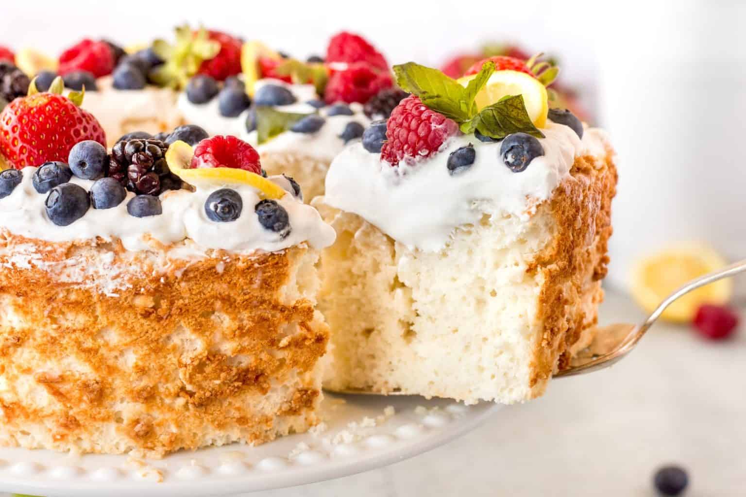 Best Angel Food Cake Recipe Noshing With The Nolands   Best Angel Food Cake Recipe Taking A Slice Horizontal 28 Custom 1536x1024 