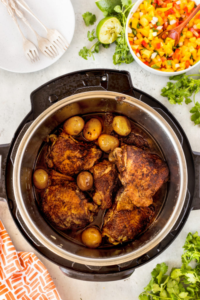 Cooked jerk chicken and potatoes in an instant pot