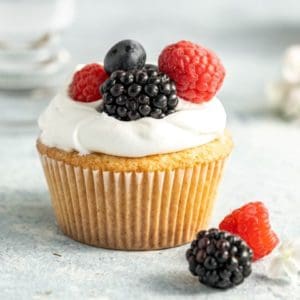 Homemade Pound Cake Cupcake with whipped cream and fresh berries