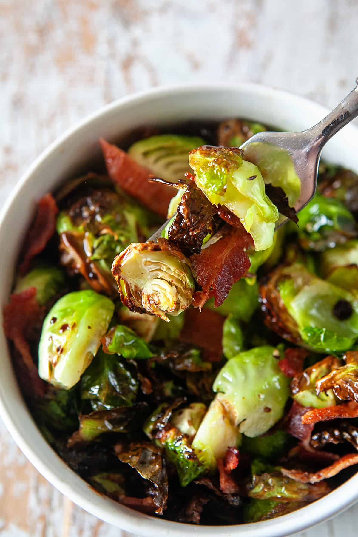 Air Fryer Brussels Sprouts on a fork with bacon