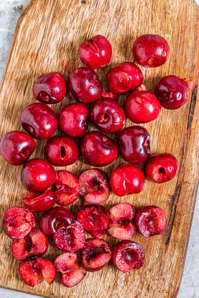 Cherries cut up on a board