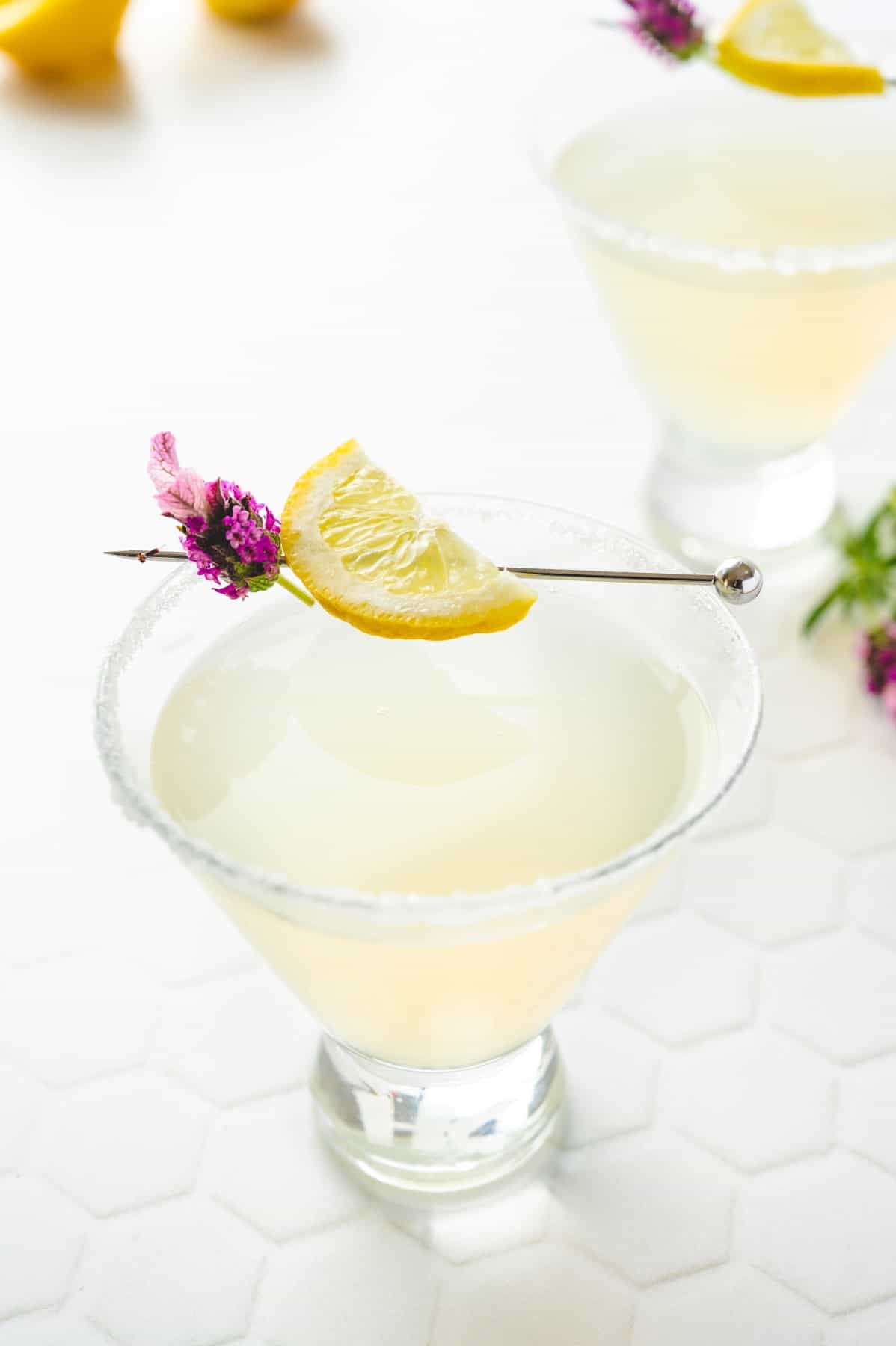 Looking at the garnish (lemon and a flower) in a martini glass. 