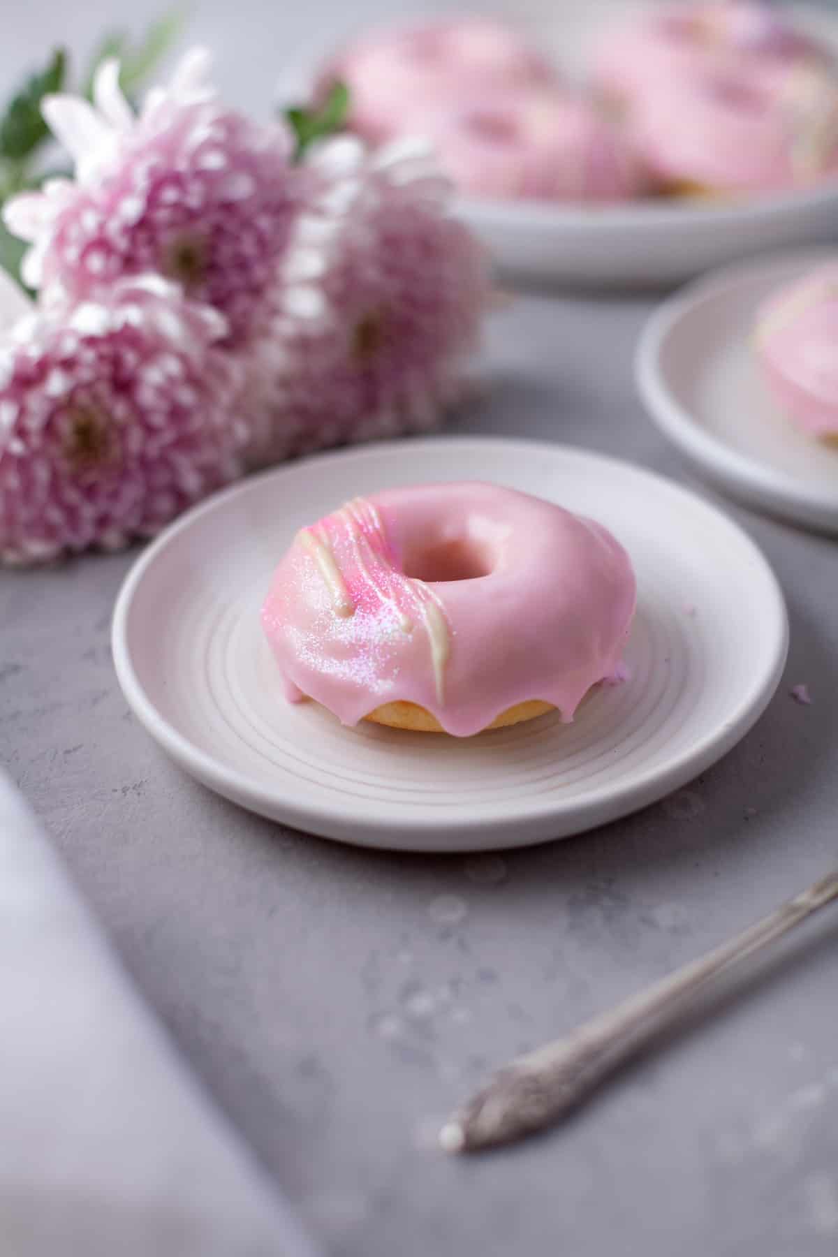 Pink donut on a plate