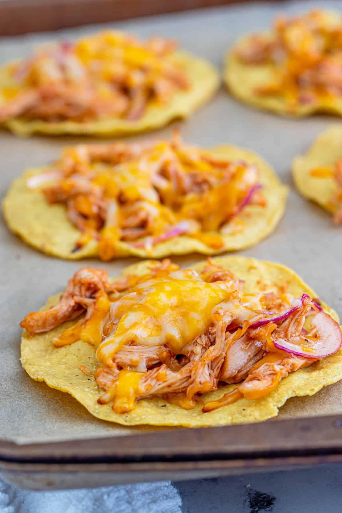 Showing melted cheese on a tostada hot out of the oven. 