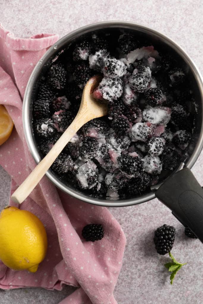 Blackberries with sugar in a pot