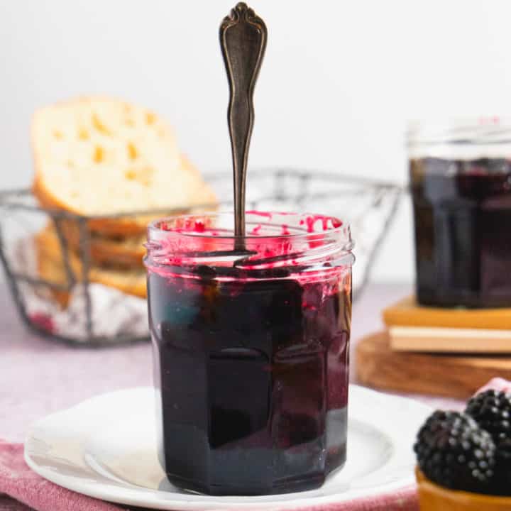 Blackberry Freezer Jam in a jar with a spoon