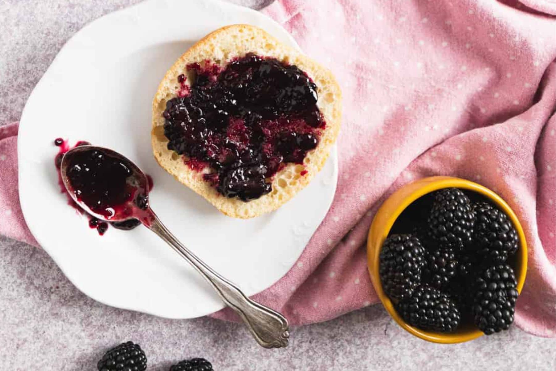 This Blackberry Freezer Jam is made in small batches; you can easily double to make more. Preserve wonderful fresh berries at their peak to enjoy all winter long. Close up of jam.
