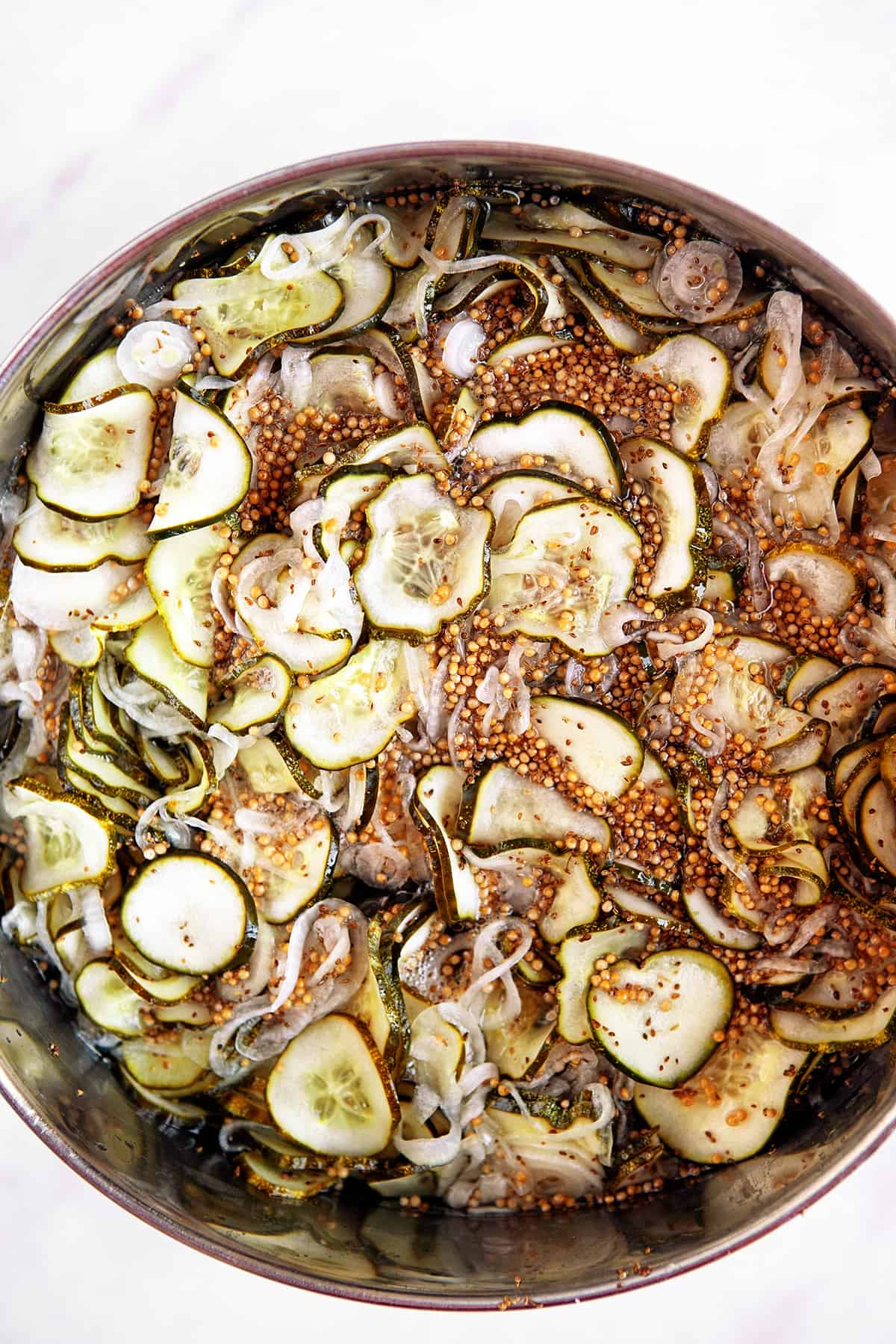 Overhead view of a pot of bread and butter pickles 